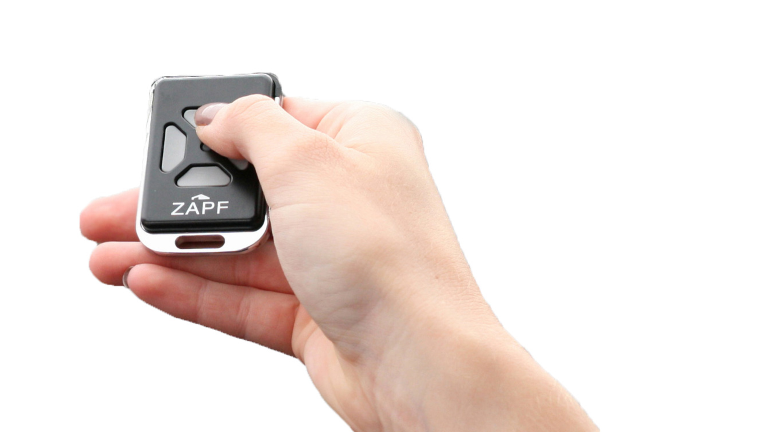 Hand hält schwarzen Garagentor-Funksender mit ZAPF Logo vor weißem Hintergrund.