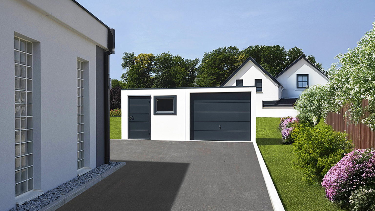 Modern precast concrete garage with sectional door, side door and window White precast concrete garage with anthracite sectional garage door, matching side door and small window, asphalt driveway in front and garden with lawn and flowering shrubs beside a residential house by ZAPF